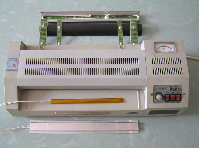 Rubber passing machine and heating parts